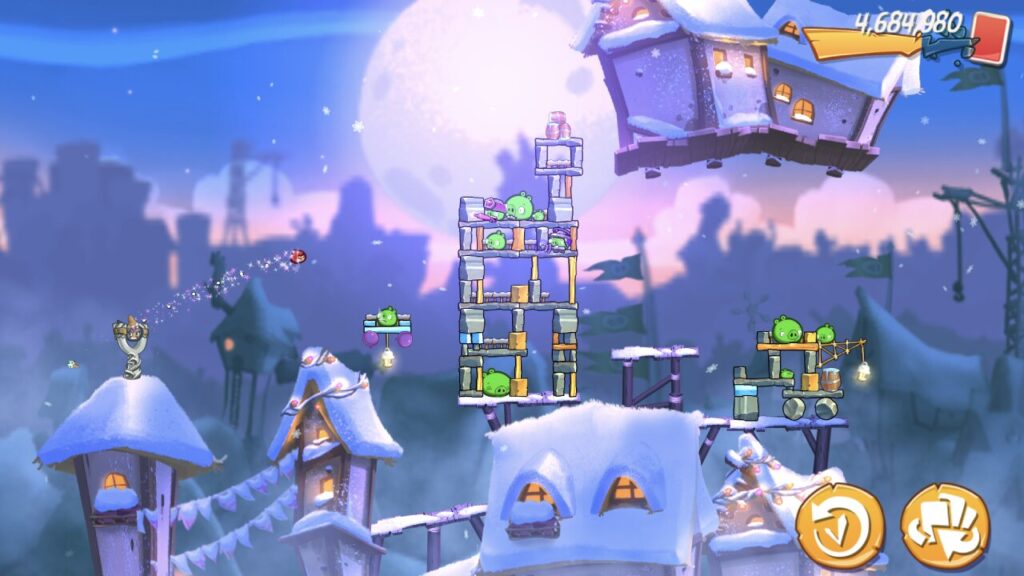 Angry Birds slingshot action in snowy offline mobile game scene